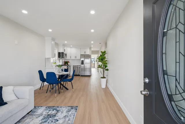 a view of a dining room with furniture and wooden floor