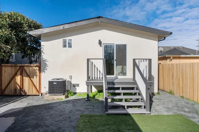 a view of a backyard with pathway