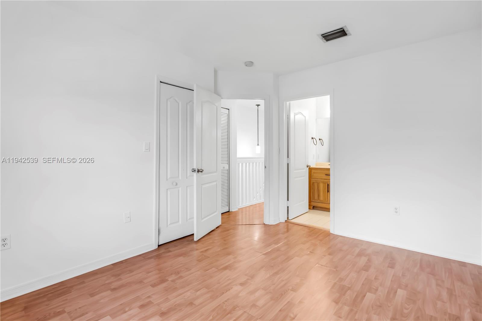 3186 Southwest 129th Terrace, Unit 113 Miramar, FL 33027 - Photo 13 of 29 a view of hallway with wooden floor