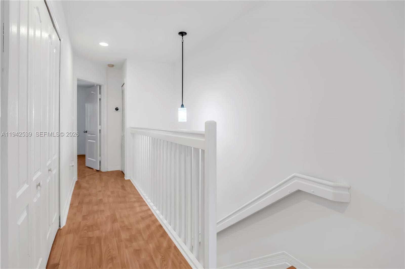 3186 Southwest 129th Terrace, Unit 113 Miramar, FL 33027 - Photo 17 of 29 a view of a hallway with wooden floor