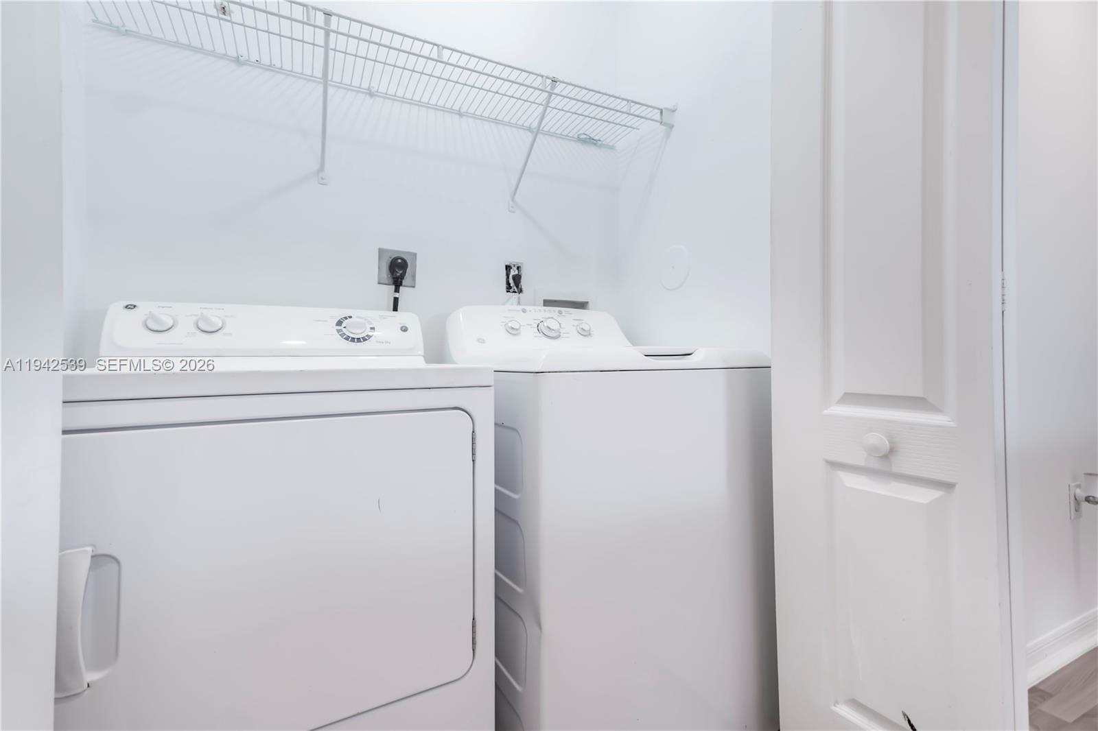 3186 Southwest 129th Terrace, Unit 113 Miramar, FL 33027 - Photo 18 of 29 a utility room with dryer and washer