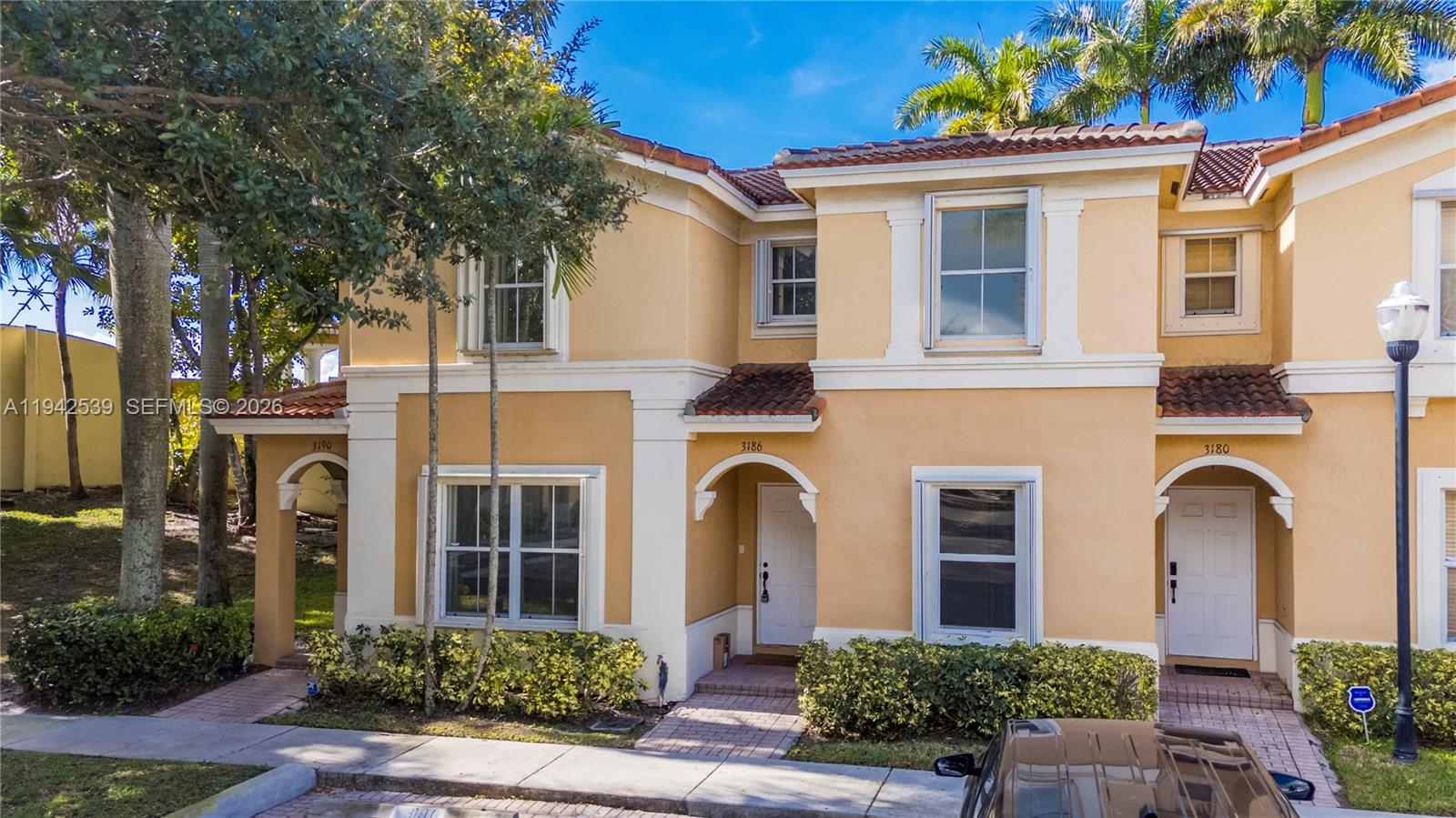 3186 Southwest 129th Terrace, Unit 113 Miramar, FL 33027 - Photo 20 of 29 front view of a house with potted plants