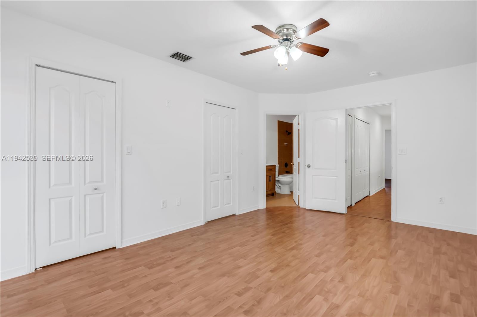 3186 Southwest 129th Terrace, Unit 113 Miramar, FL 33027 - Photo 10 of 29 an empty room with fan and a ceiling fan
