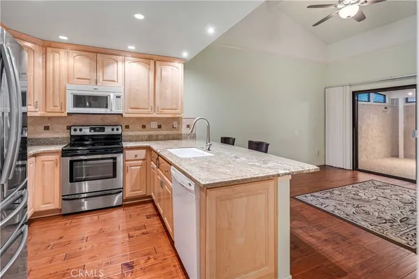 a kitchen with a stove and a microwave