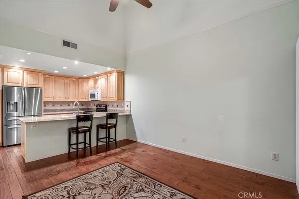a view of kitchen with wooden floor