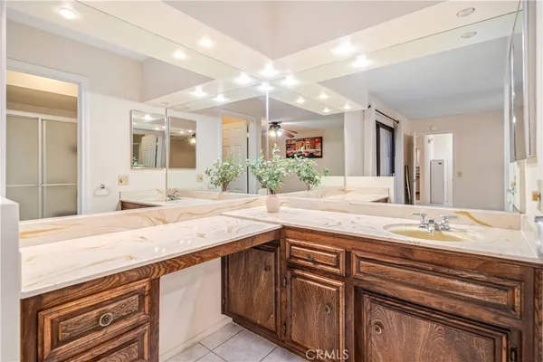 a bathroom with a sink double vanity and a mirror