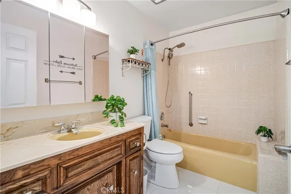 a bathroom with a sink a bathtub and a toilet