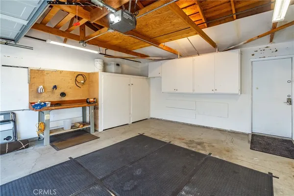 a view of a white house with a outdoor space