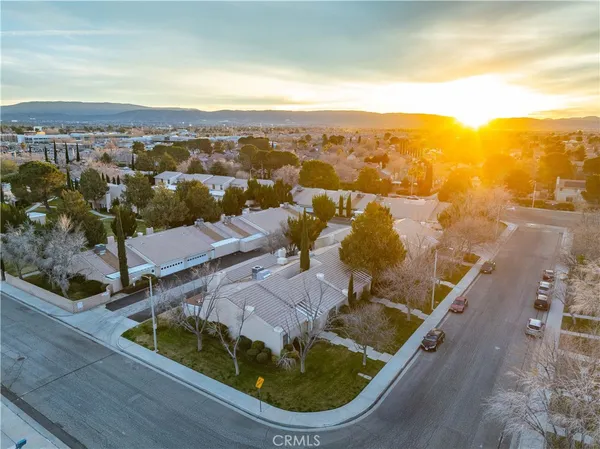 an aerial view of a residential houses and city street