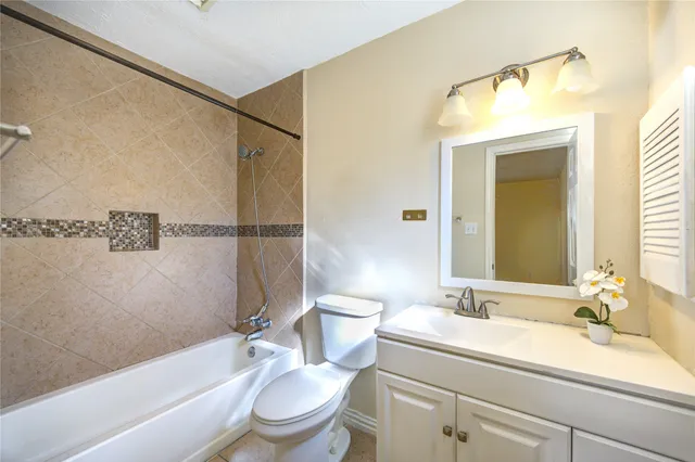 a bathroom with a sink a toilet and a bathtub