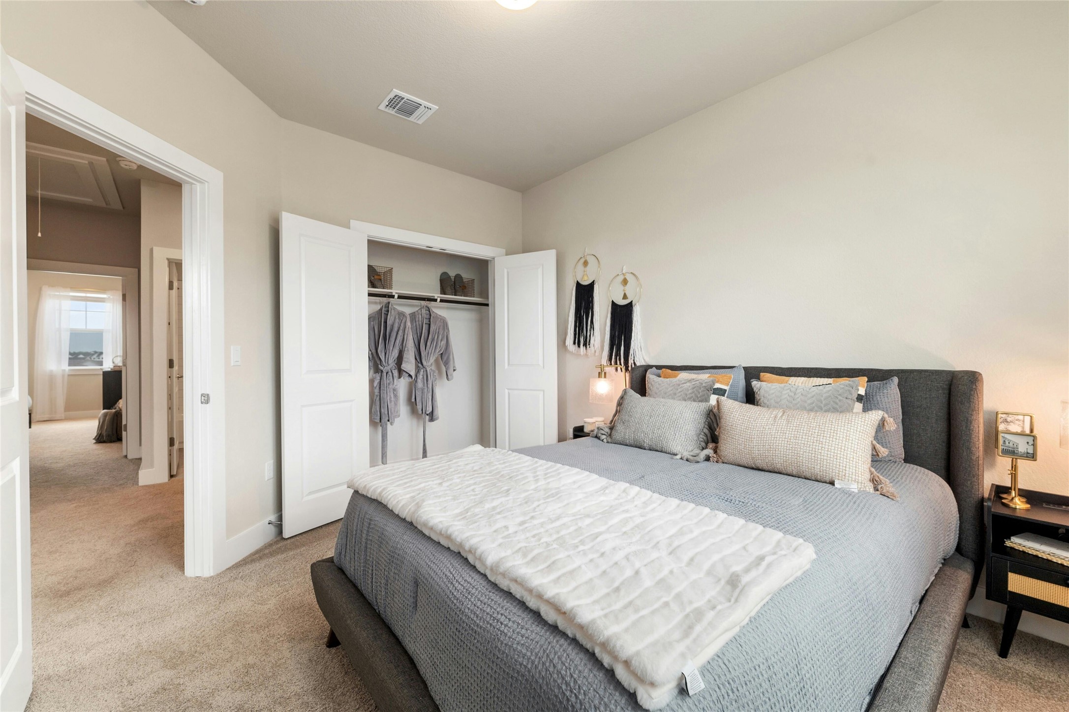 5804 Rotunda View Austin, TX 78747 - Photo 19 of 27 Comfortable bedroom with neutral walls and soft carpet flooring awaits tranquil rest.