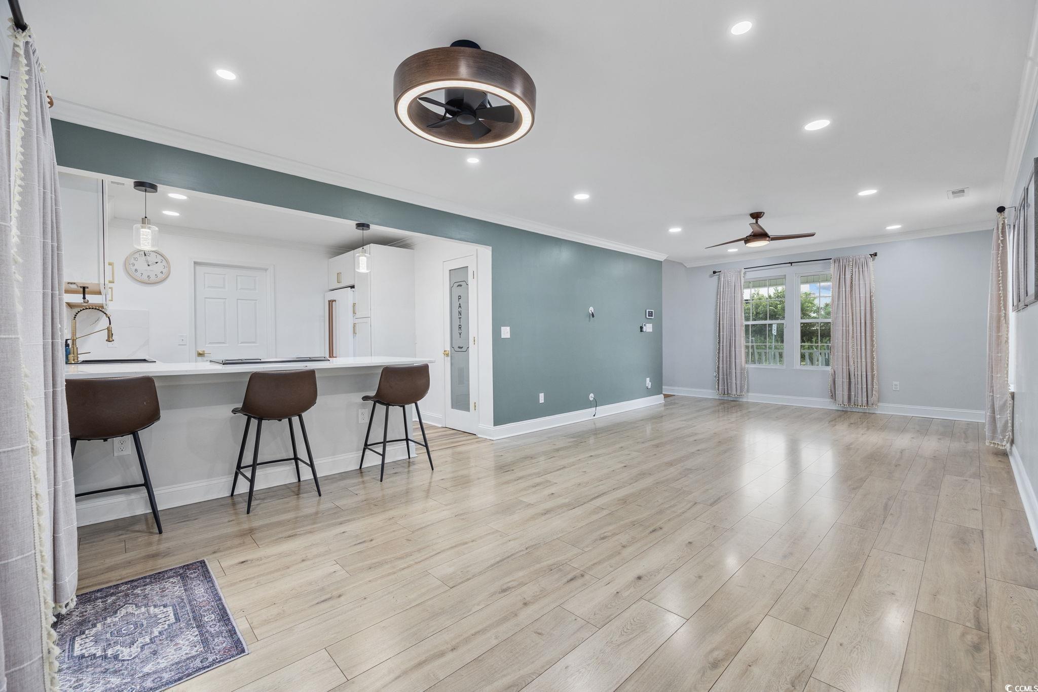 118 Sly Fox Trail Myrtle Beach, SC 29588 - Photo 12 of 40 Living room with ornamental molding, light wood-style flooring, recessed lighting, and ceiling fan