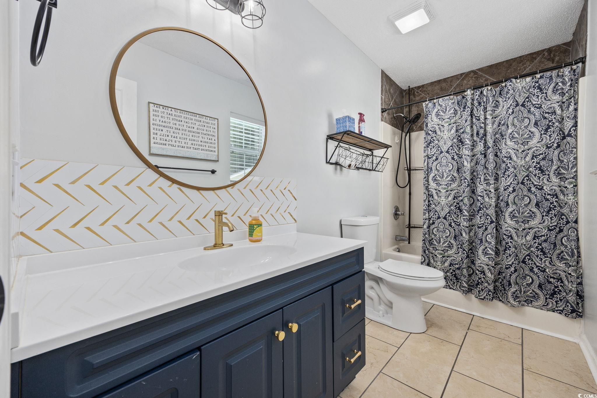 118 Sly Fox Trail Myrtle Beach, SC 29588 - Photo 21 of 40 Full bathroom featuring shower / bath combination with curtain, vanity, and light tile patterned flooring