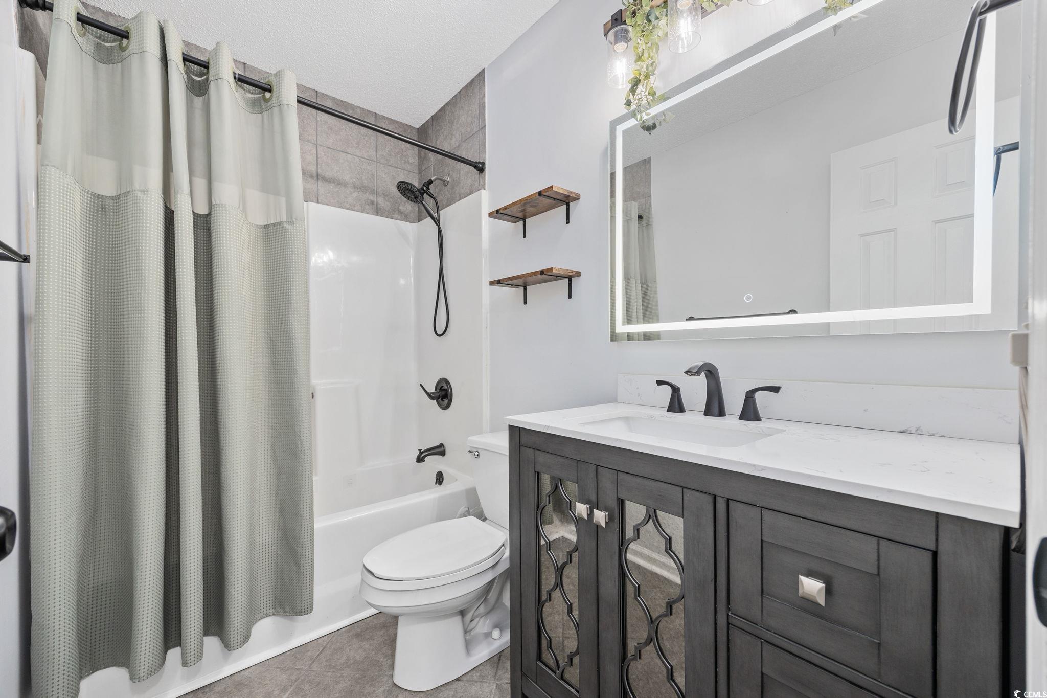 118 Sly Fox Trail Myrtle Beach, SC 29588 - Photo 24 of 40 Full bathroom featuring shower / bath combo, vanity, and light tile patterned floors
