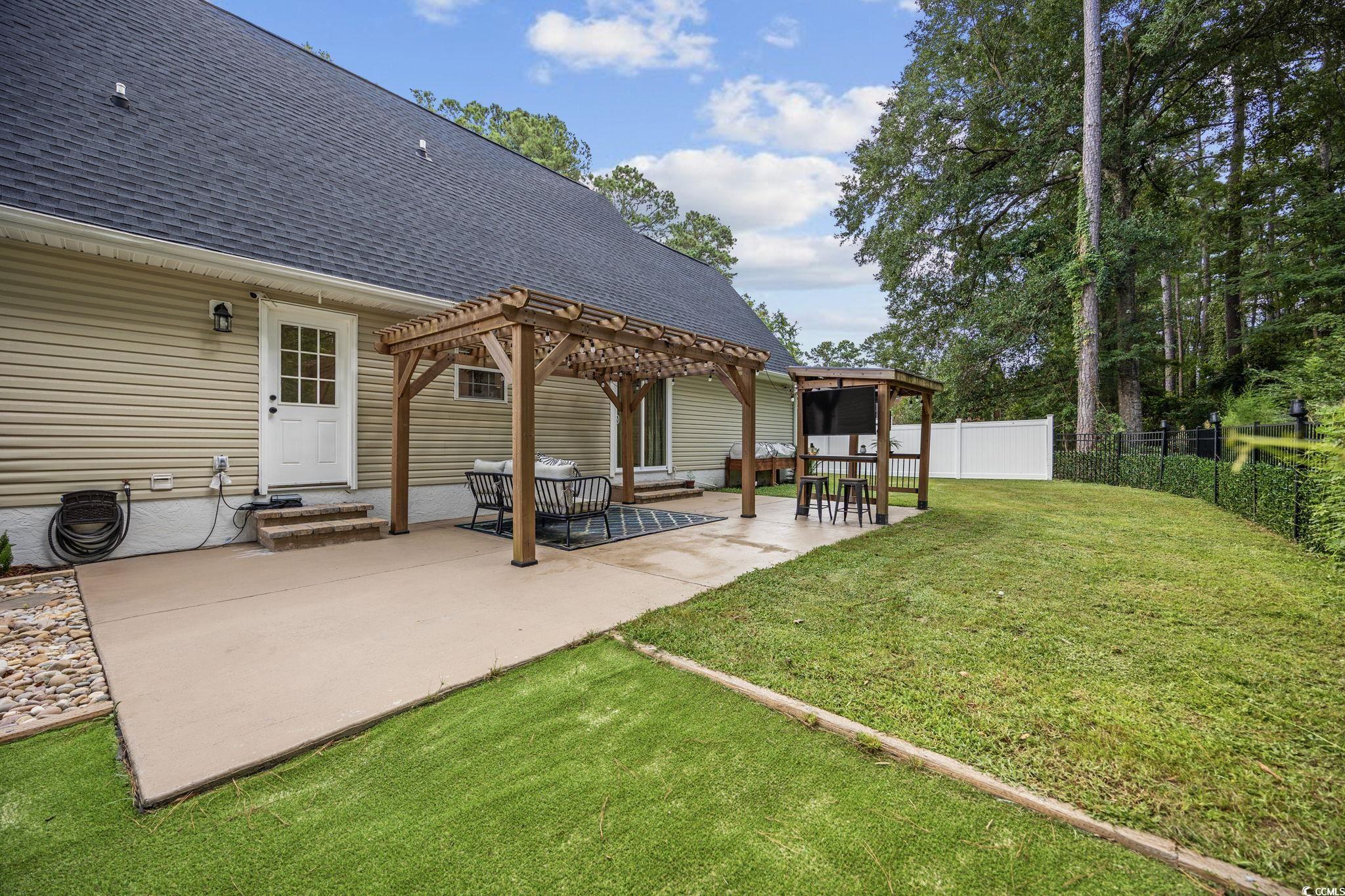 118 Sly Fox Trail Myrtle Beach, SC 29588 - Photo 30 of 40 Fenced backyard with a gazebo, a patio, and a pergola