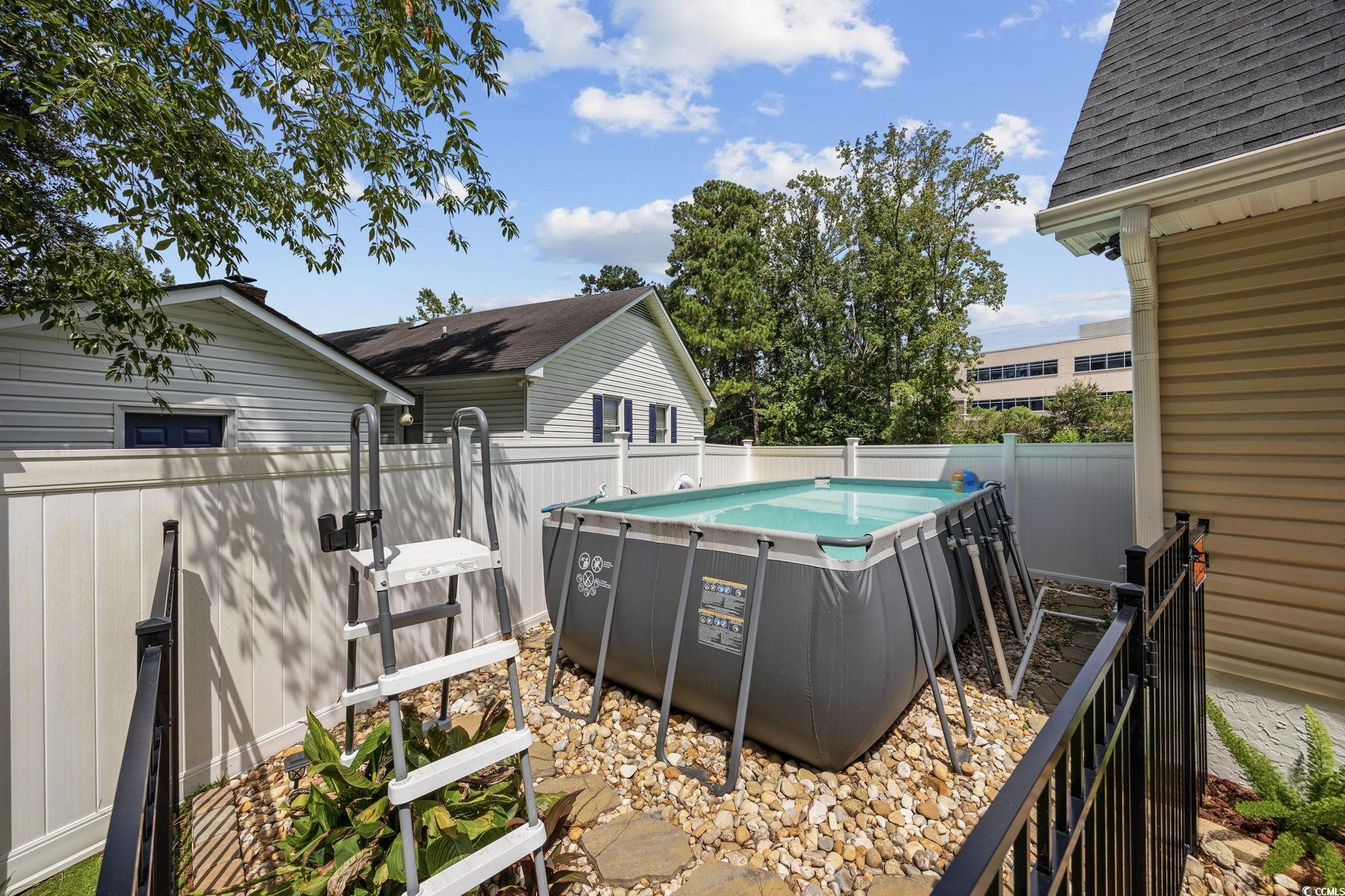 118 Sly Fox Trail Myrtle Beach, SC 29588 - Photo 37 of 40 View of swimming pool featuring a fenced backyard and a patio