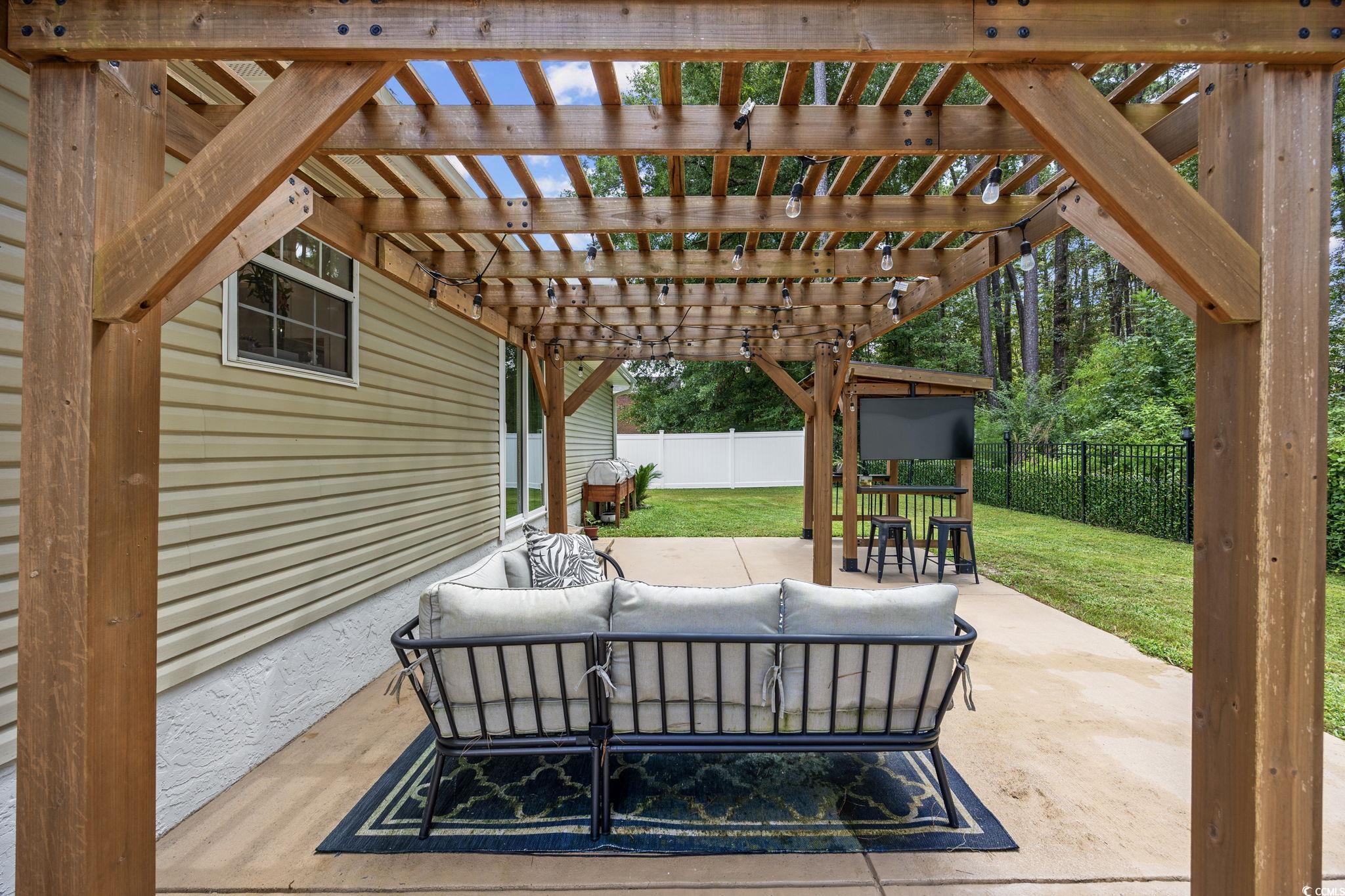 118 Sly Fox Trail Myrtle Beach, SC 29588 - Photo 38 of 40 Fenced backyard with outdoor lounge area, a patio, and a pergola