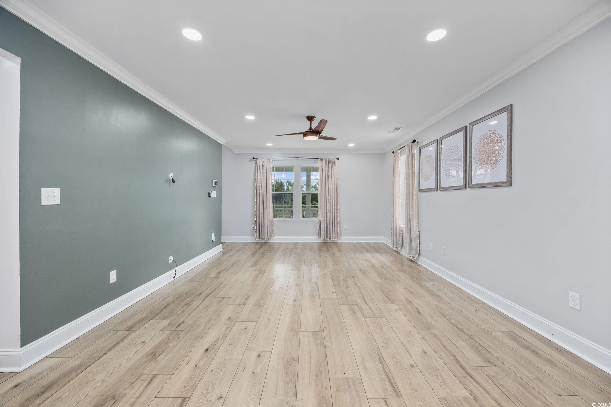 118 Sly Fox Trail Myrtle Beach, SC 29588 - Photo 10 of 40 Empty room with crown molding, recessed lighting, light wood-style floors, and ceiling fan