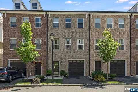 a front view of a house with yard