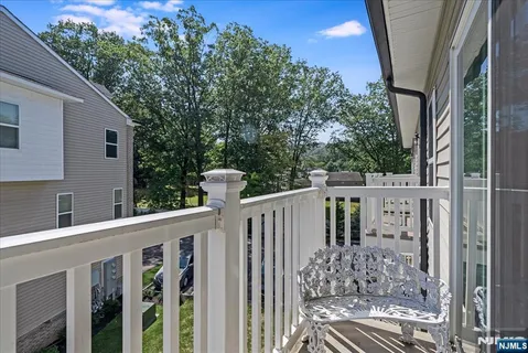 a view of a house with wooden fence