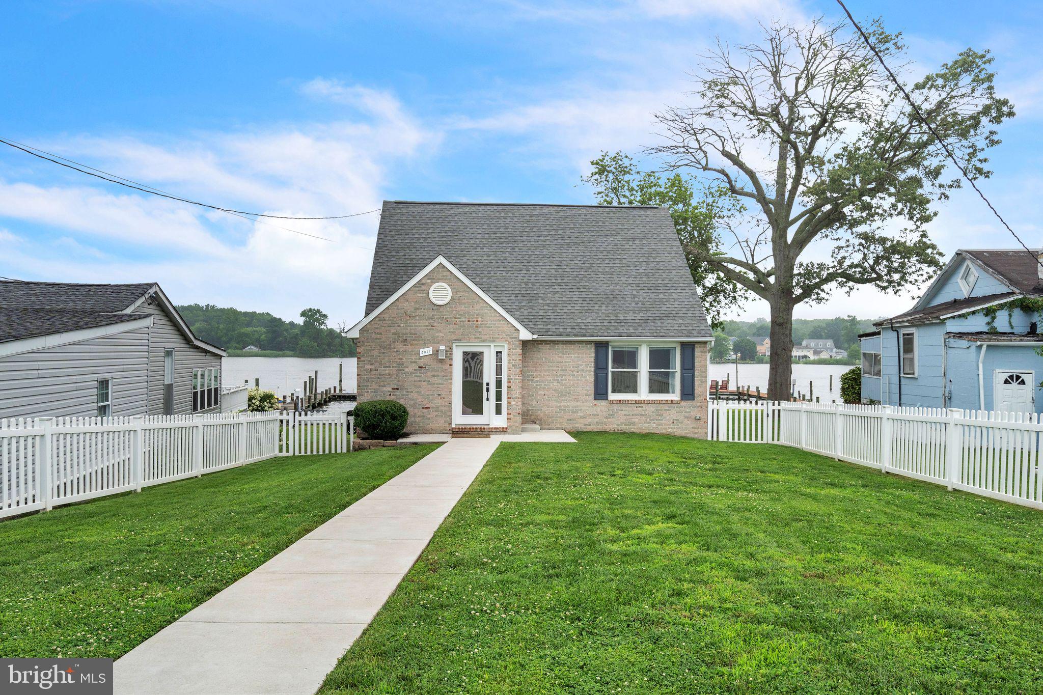 4012 Chestnut Road Baltimore, MD 21220 - Photo 2 of 58 a front view of a house with a yard