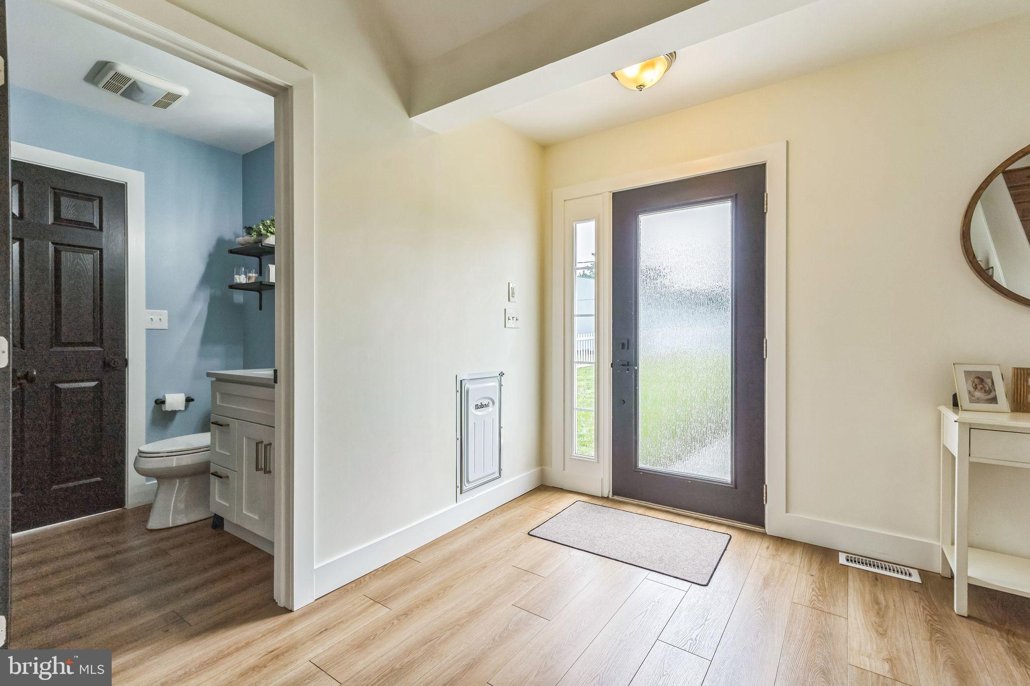 4012 Chestnut Road Baltimore, MD 21220 - Photo 24 of 58 a bathroom with a granite countertop toilet and a sink