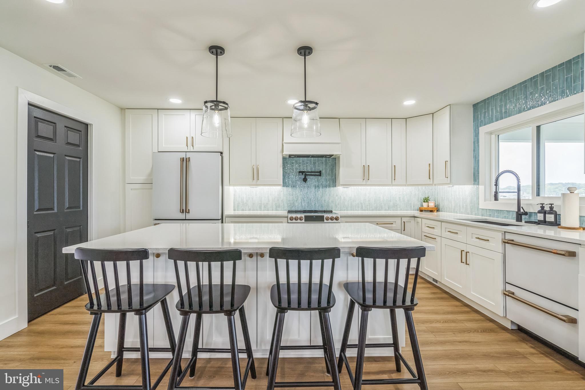 4012 Chestnut Road Baltimore, MD 21220 - Photo 28 of 58 a kitchen with granite countertop white cabinets and stainless steel appliances