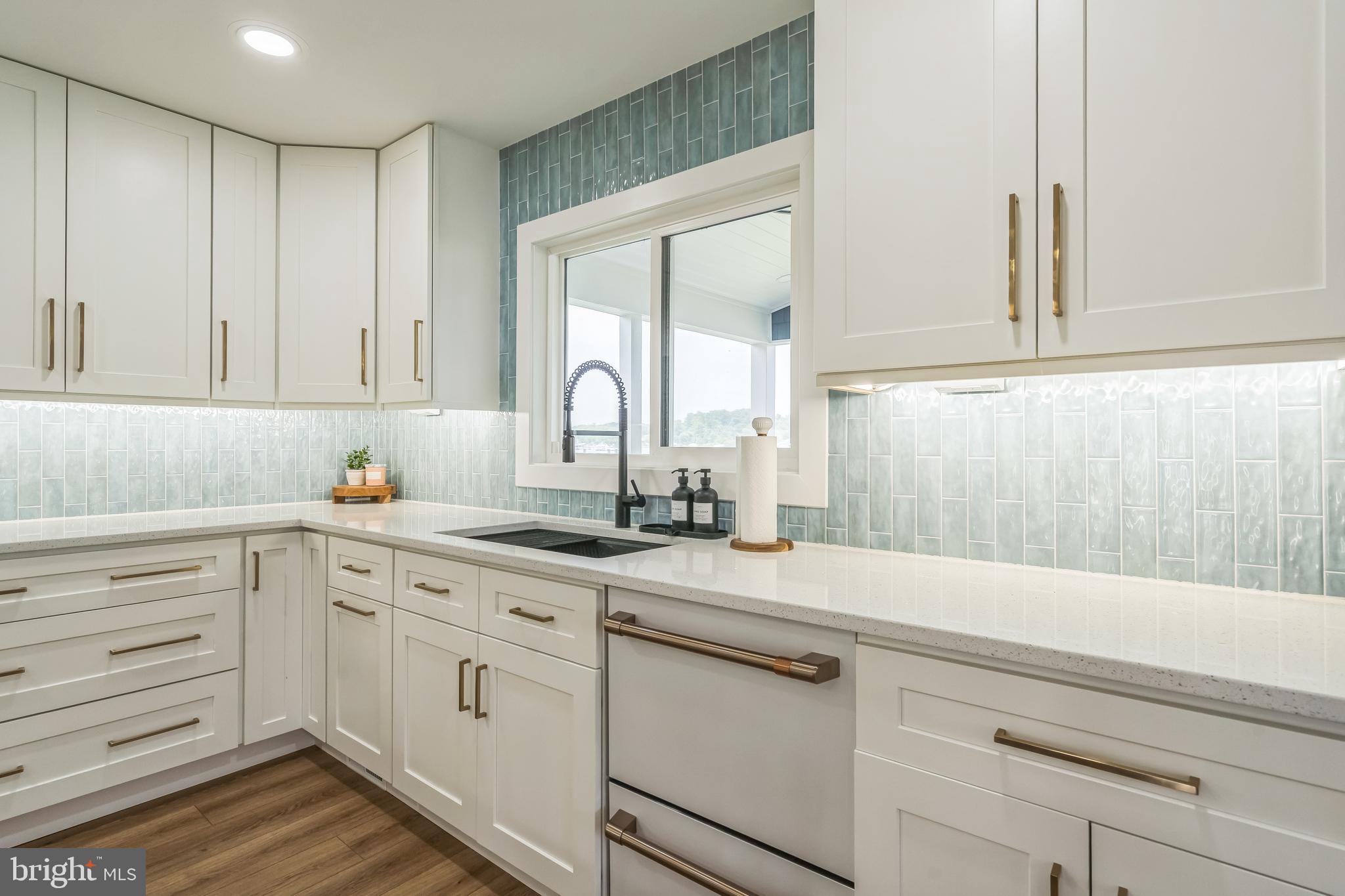 4012 Chestnut Road Baltimore, MD 21220 - Photo 29 of 58 a kitchen with cabinets appliances a sink and a window