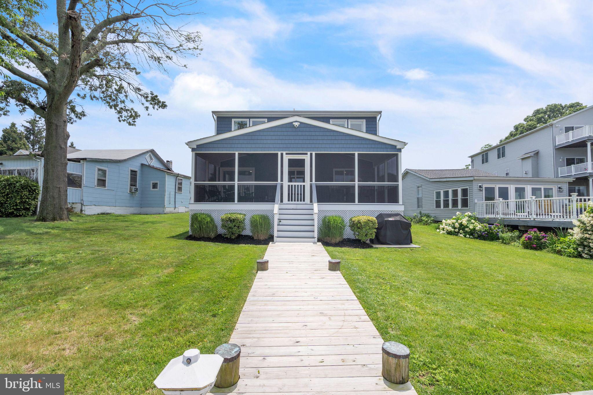 4012 Chestnut Road Baltimore, MD 21220 - Photo 3 of 58 a front view of a house with a yard and porch
