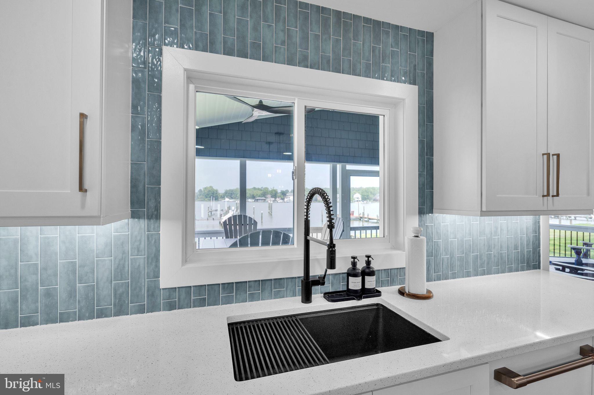 4012 Chestnut Road Baltimore, MD 21220 - Photo 31 of 58 a kitchen with a sink a counter top space and a large window