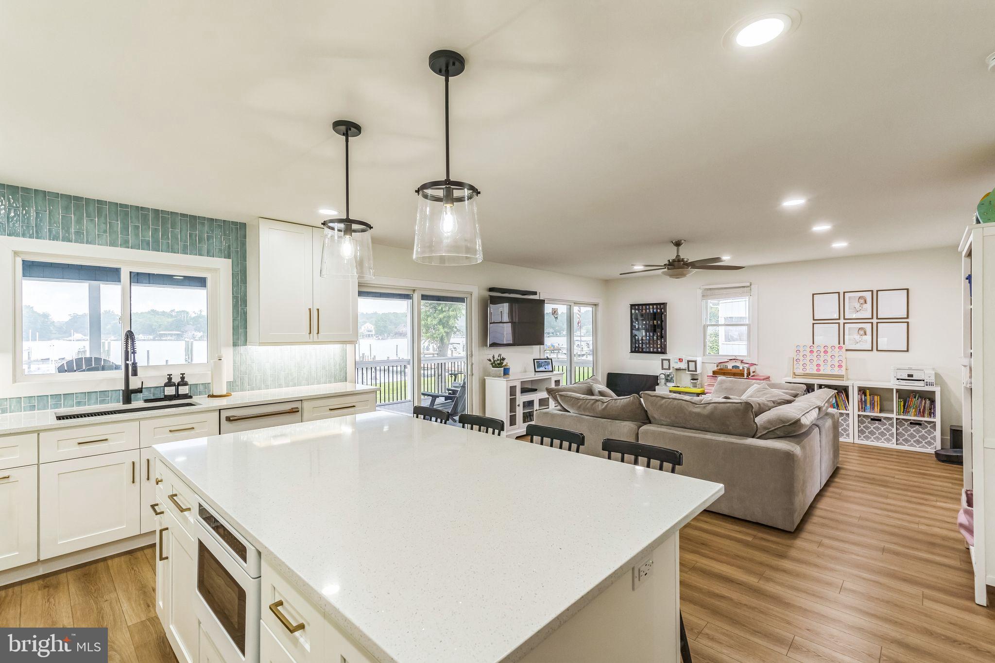 4012 Chestnut Road Baltimore, MD 21220 - Photo 34 of 58 a living room with stainless steel appliances granite countertop furniture and a wooden floor
