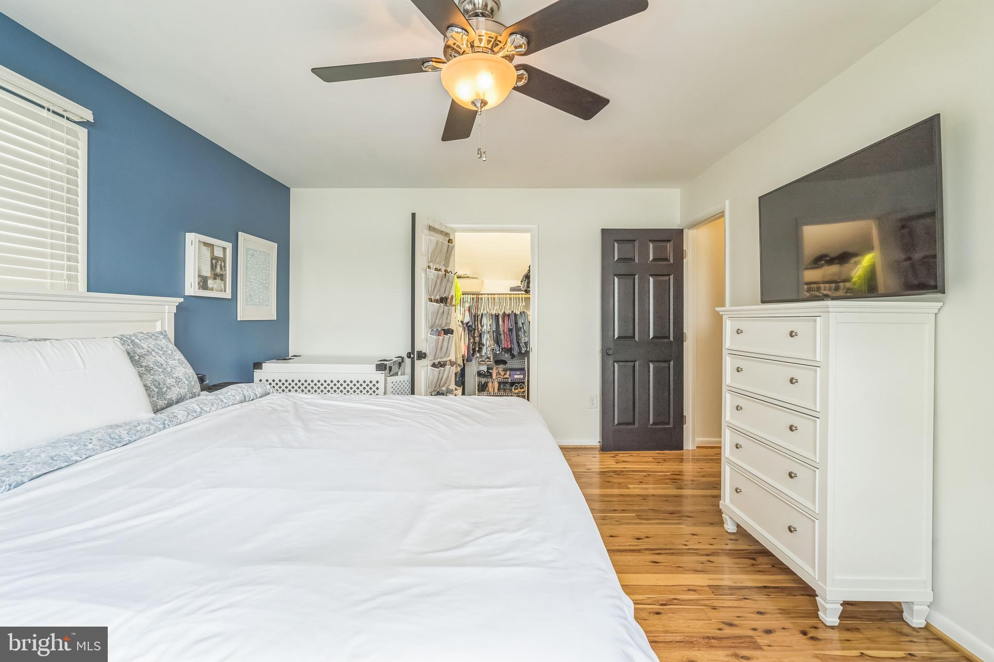 4012 Chestnut Road Baltimore, MD 21220 - Photo 46 of 58 a spacious bedroom with a bed and a flat screen tv