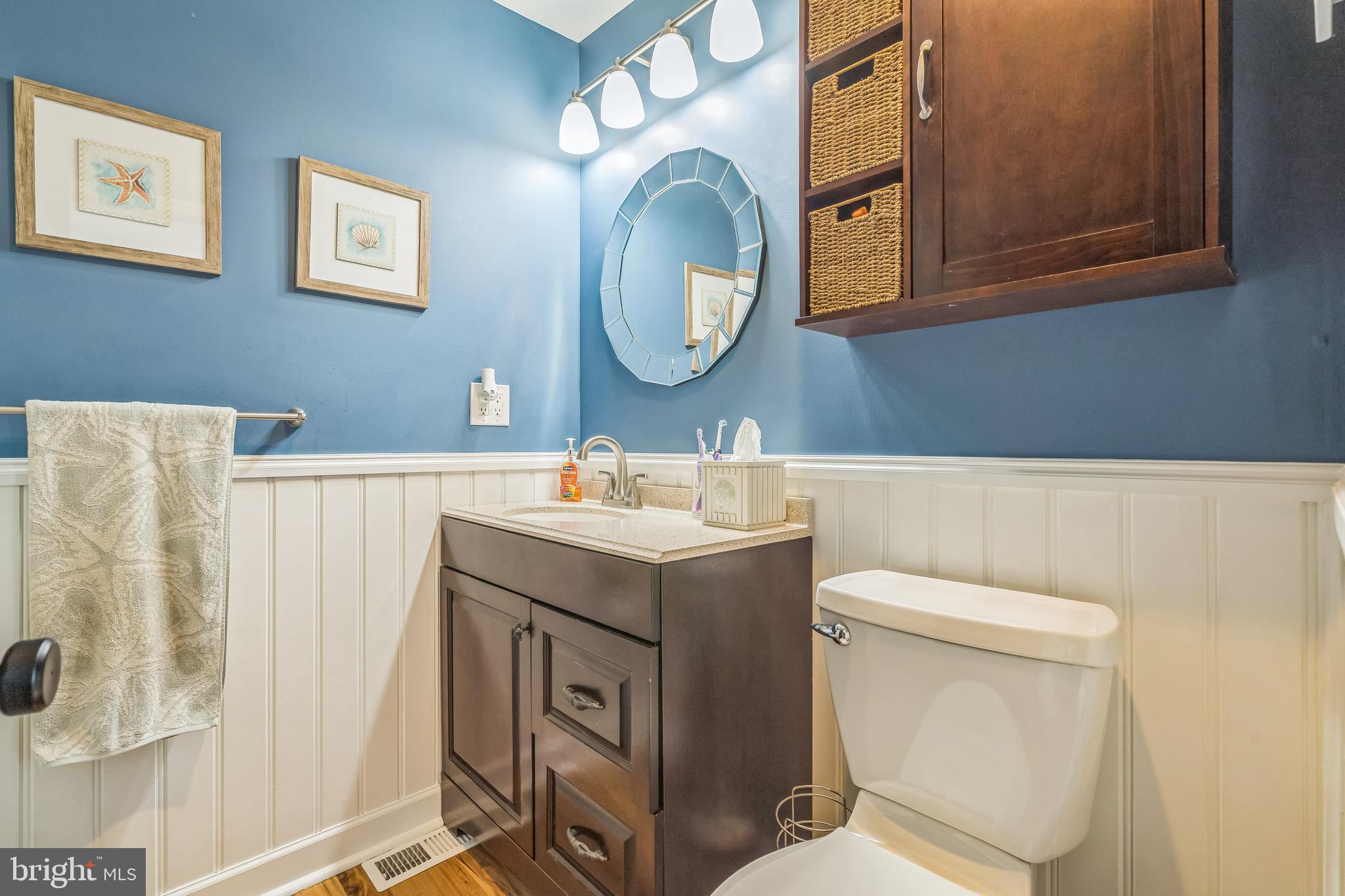 4012 Chestnut Road Baltimore, MD 21220 - Photo 51 of 58 a bathroom with a toilet sink and mirror