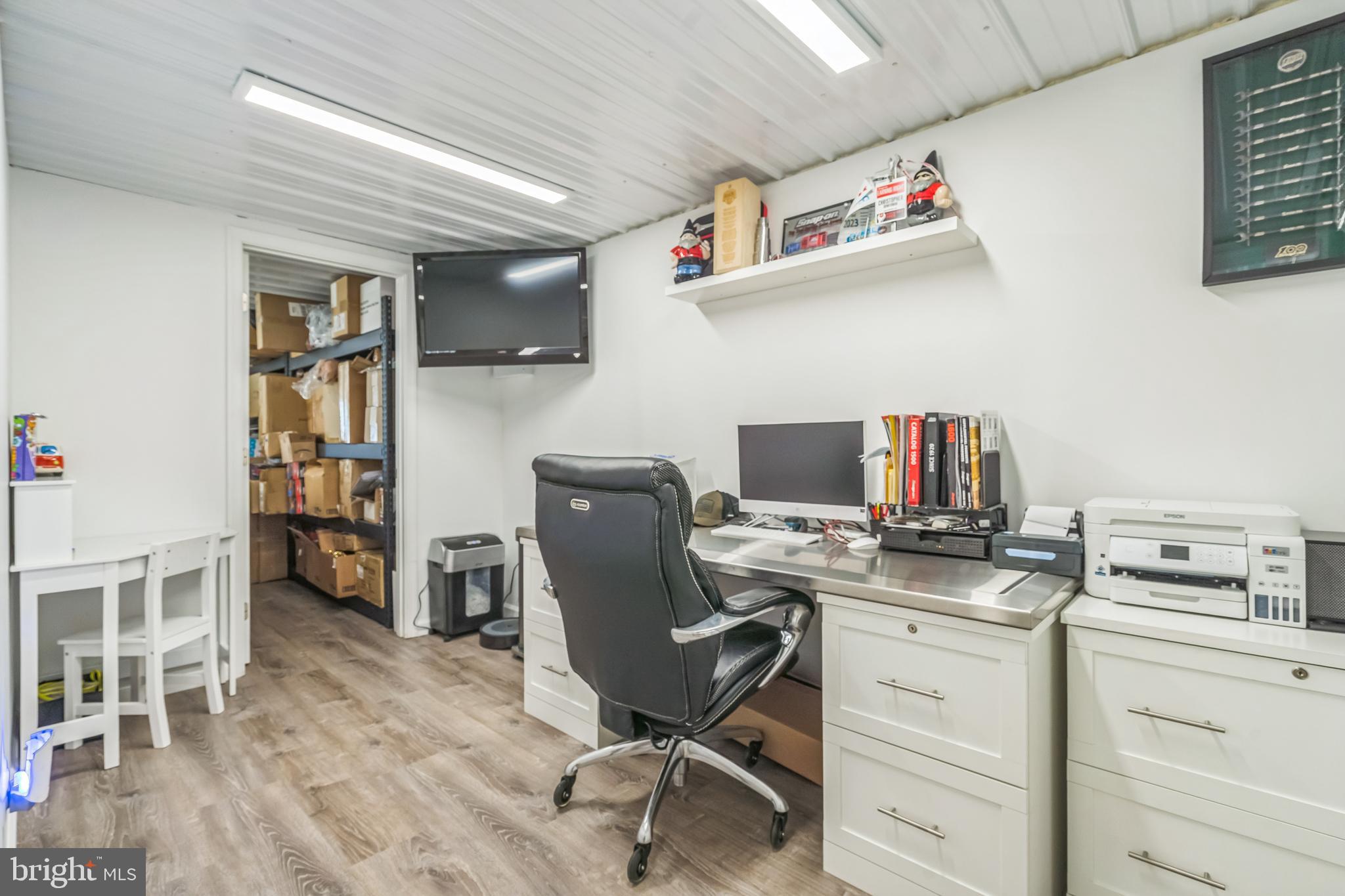 4012 Chestnut Road Baltimore, MD 21220 - Photo 56 of 58 a view of a workspace with furniture and a window