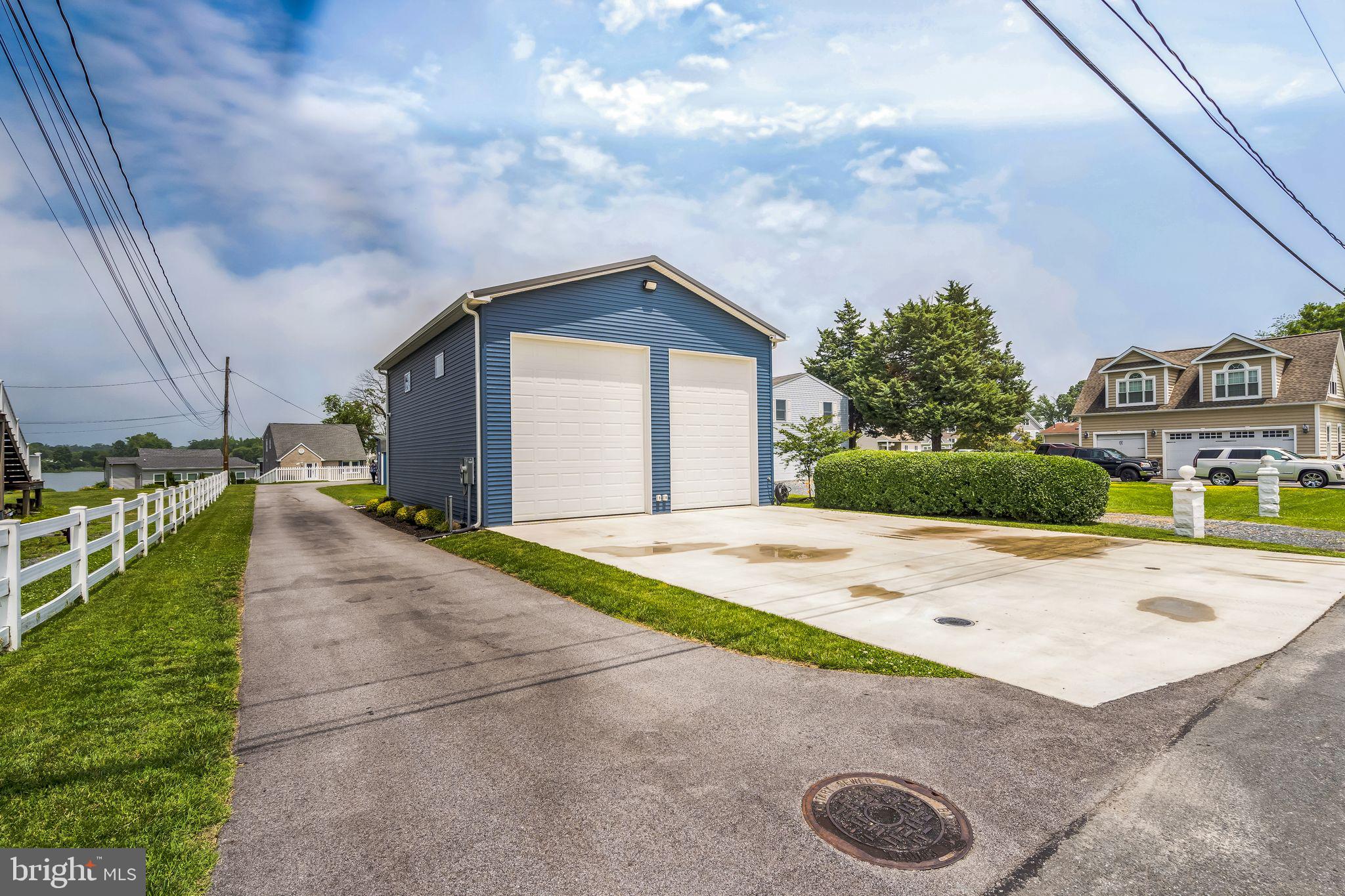 4012 Chestnut Road Baltimore, MD 21220 - Photo 8 of 58 a front view of a house with a yard and garage
