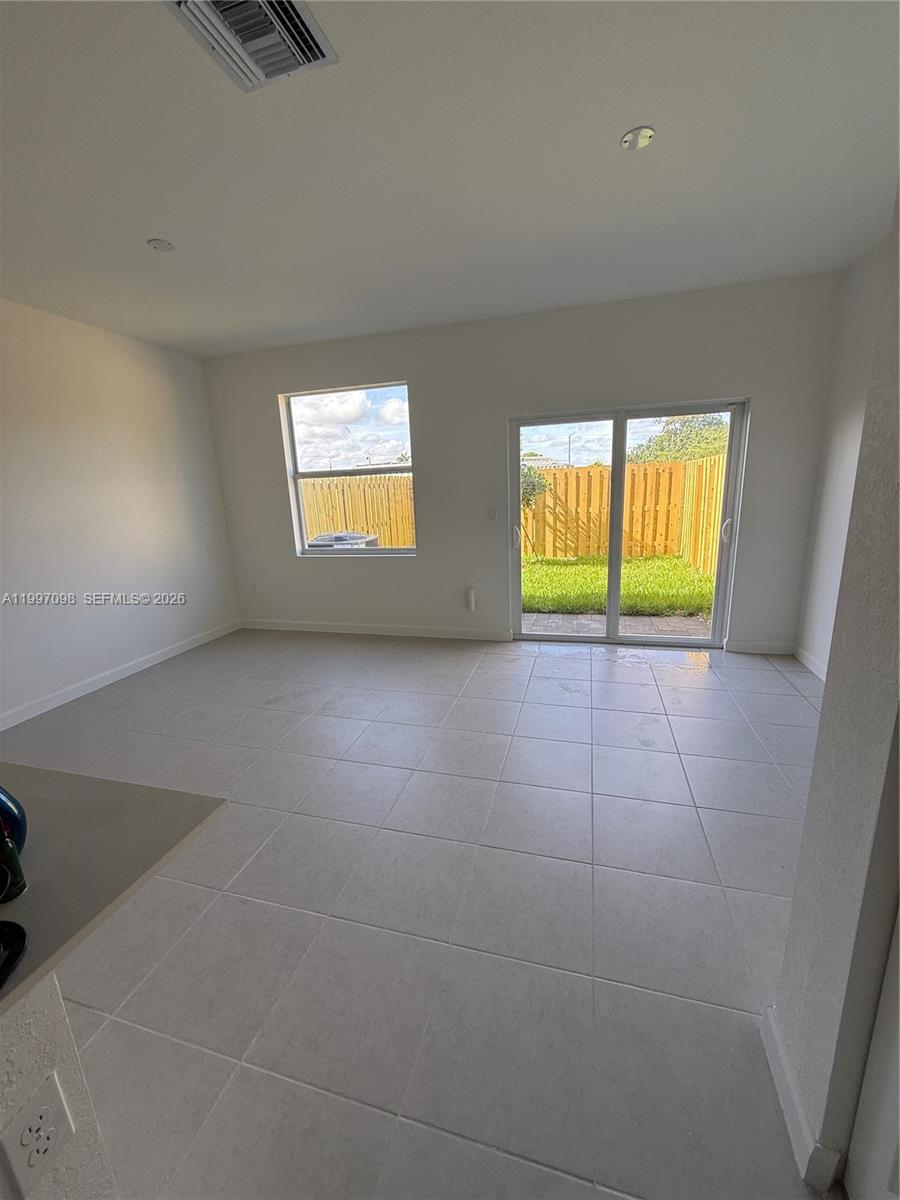 17907 Southwest 356th Street, Unit 17907 Homestead, FL 33034 - Photo 2 of 14 en view interior of a house and an empty room