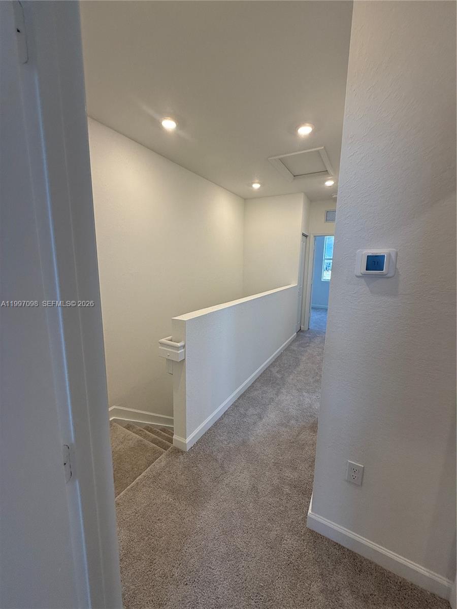 17907 Southwest 356th Street, Unit 17907 Homestead, FL 33034 - Photo 5 of 14 a view of hallway