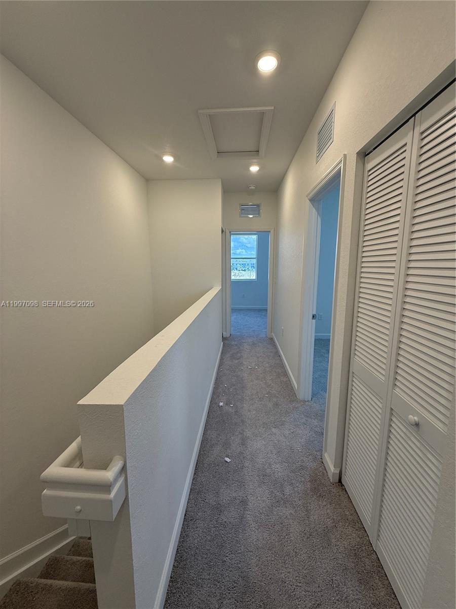 17907 Southwest 356th Street, Unit 17907 Homestead, FL 33034 - Photo 6 of 14 a view of hallway with stairs