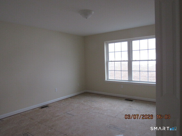 57 Warm Earth Road Naugatuck, CT 06770 - Photo 8 of 24 an empty room with a window