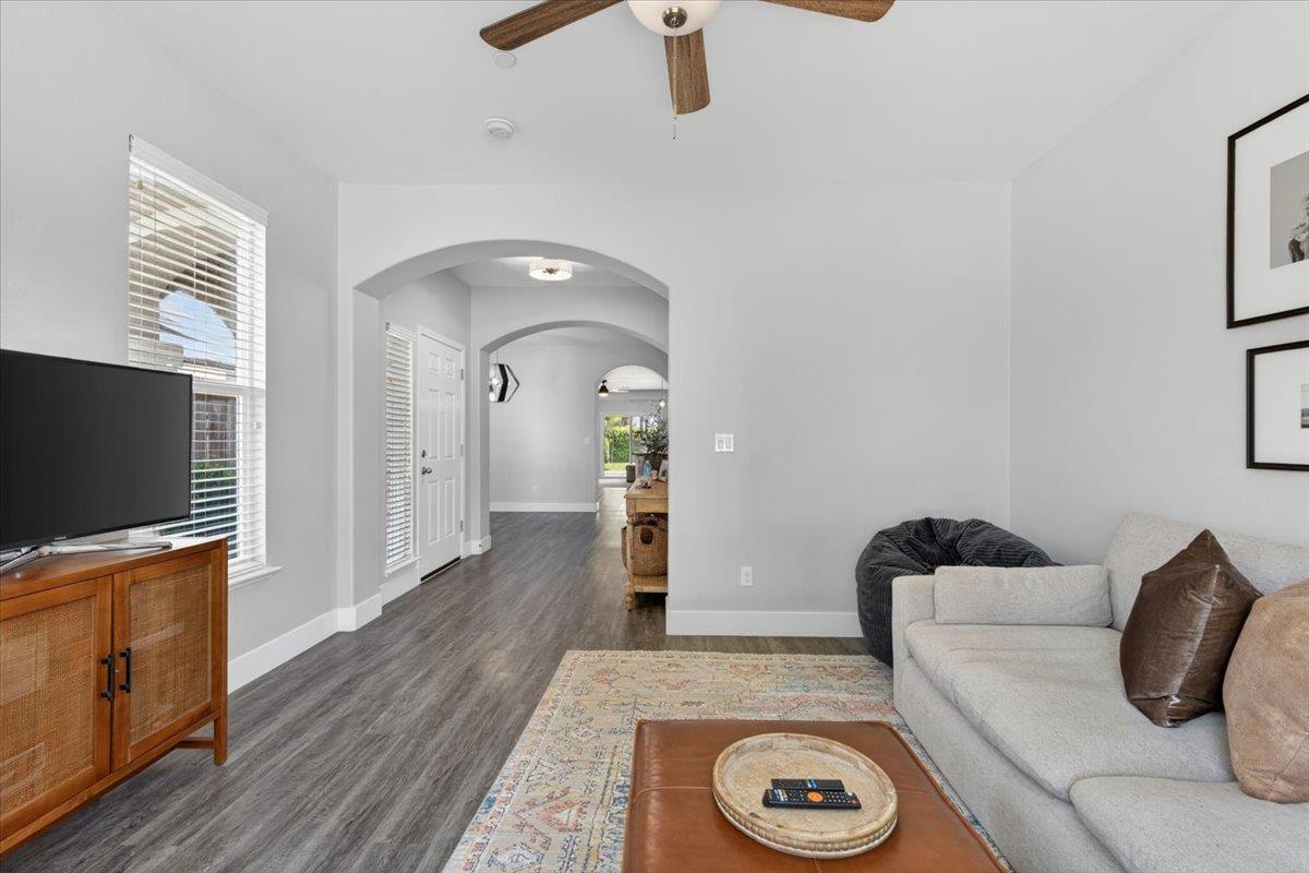 437 Silver Ridge Court Oakdale, CA 95361 - Photo 6 of 41 a living room with furniture and a flat screen tv