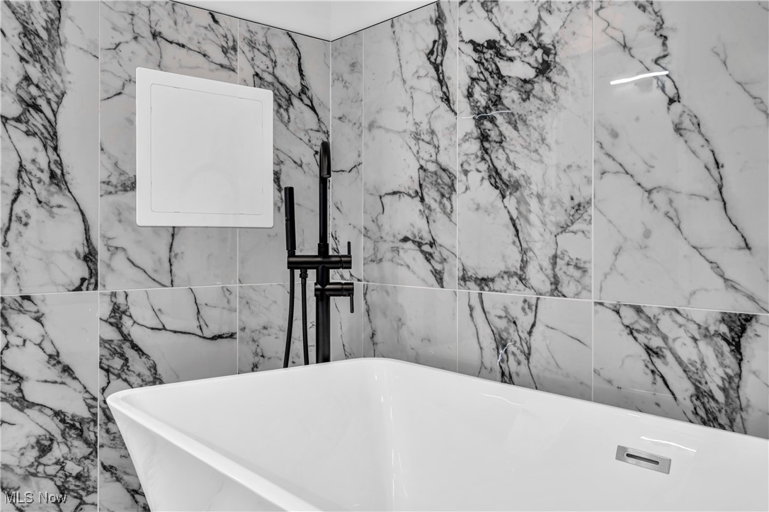 6230 Dunham Road Maple Heights, OH 44137 - Photo 26 of 31 Room details with a tub to relax in