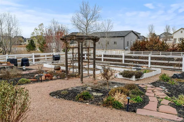a view of a roof deck with wooden fence