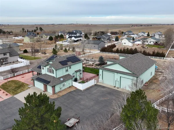an aerial view of a house with garden space