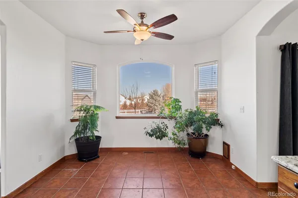a view of room with a window and wooden floor