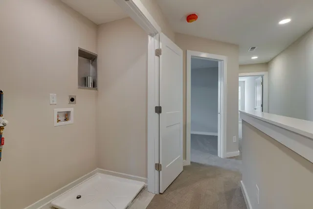 a bathroom with a shower and a sink