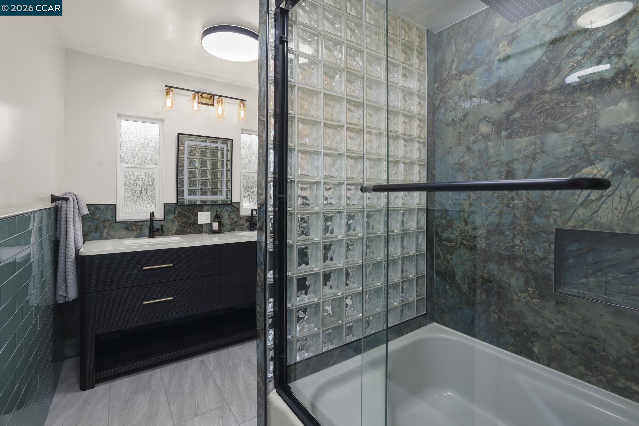 1051 San Rafael Street San Leandro, CA 94577 - Photo 15 of 26 a bathroom with a bathtub and a sink