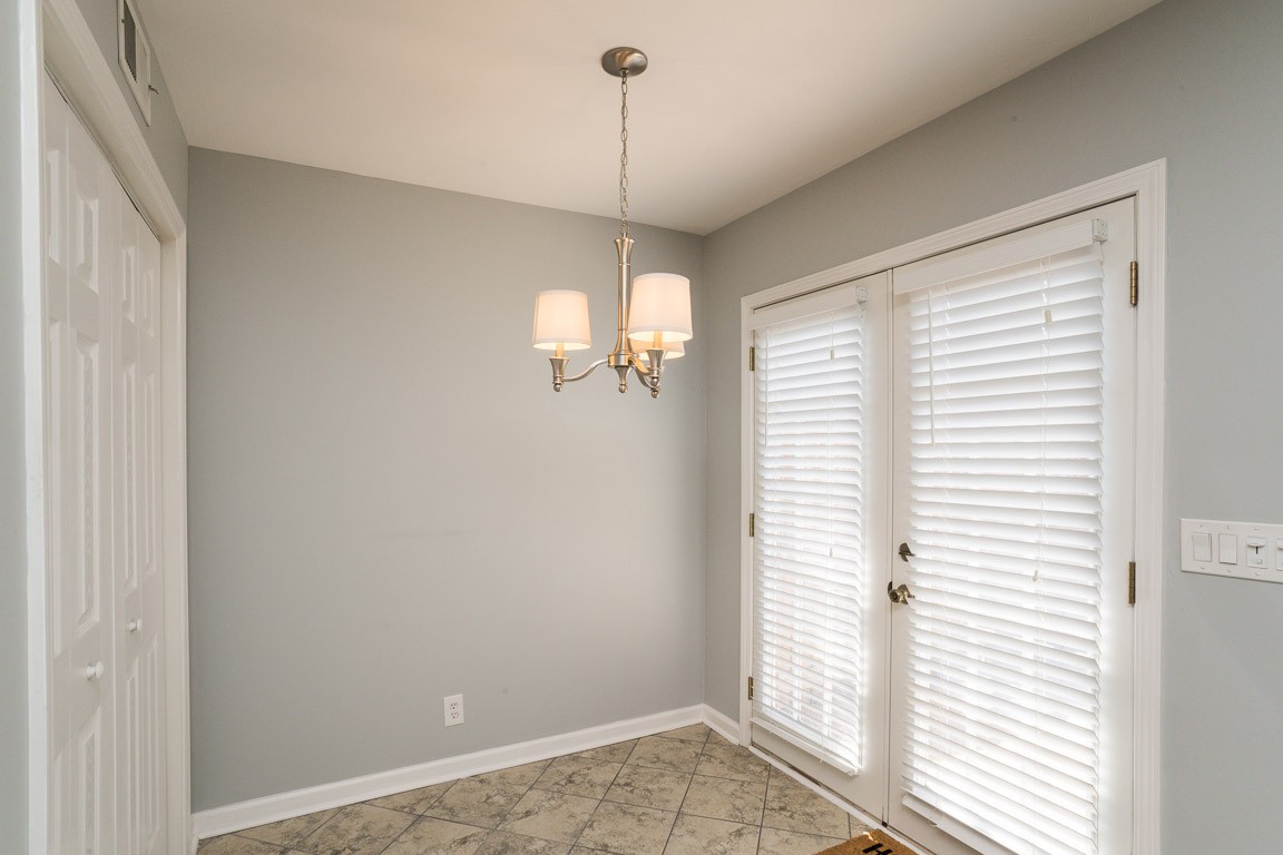 711 Kent Road Nashville, TN 37214 - Photo 14 of 31 a view of a room with a window and chandelier