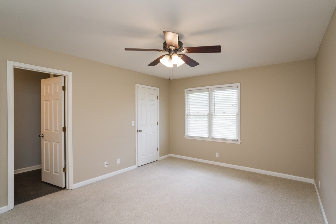 711 Kent Road Nashville, TN 37214 - Photo 16 of 31 wooden floor in an empty room with a window