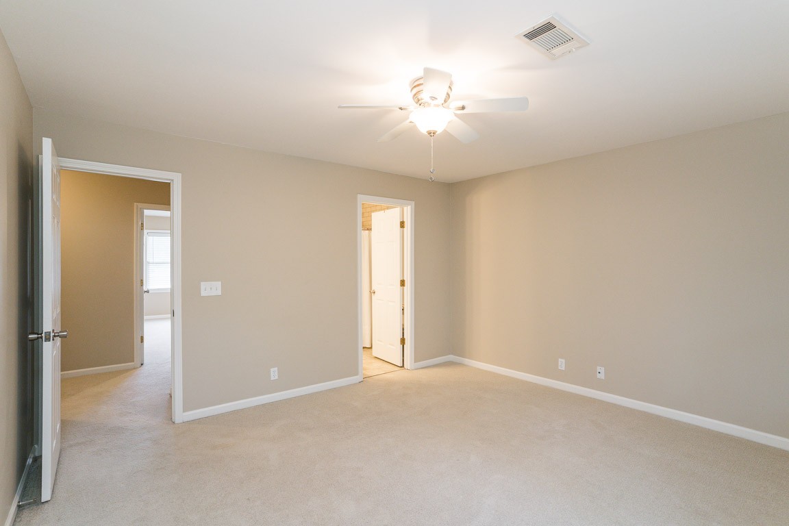 711 Kent Road Nashville, TN 37214 - Photo 24 of 31 an empty room with chandelier fan