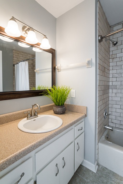 711 Kent Road Nashville, TN 37214 - Photo 25 of 31 a bathroom with a granite countertop sink a mirror a vanity and a shower